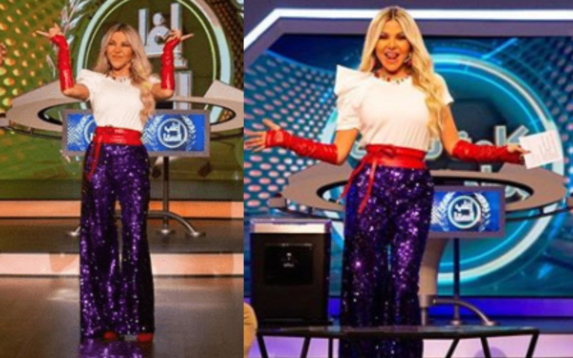 بنطلون بقماشة لامعة مع توب أبيض وحزام وقفازات باللون الأحمر