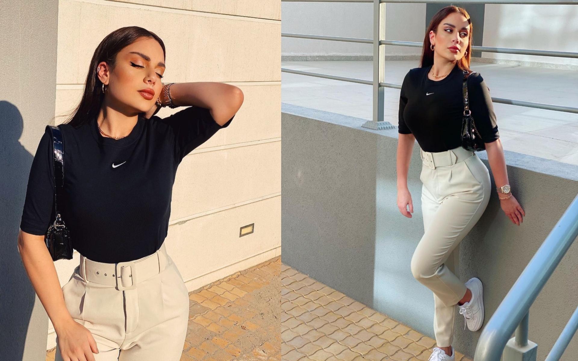 إطلالة كاجول أنيقة مكونة من توب أسود رياضي وبنطلون ذو خصر عالي وحذاء رياضي